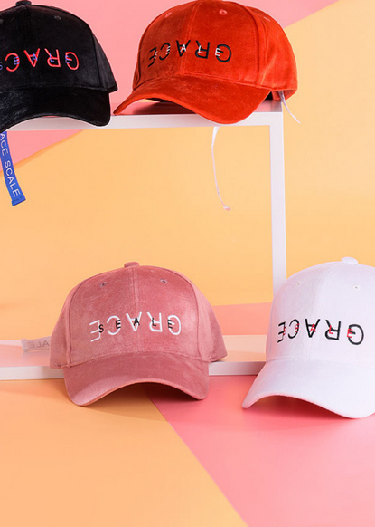 hats with the word GRACE upside down