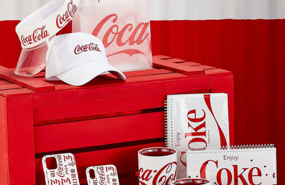 MINISO x Coca-Cola collaboration collection products: hat, visor, bag, phone case, mugs