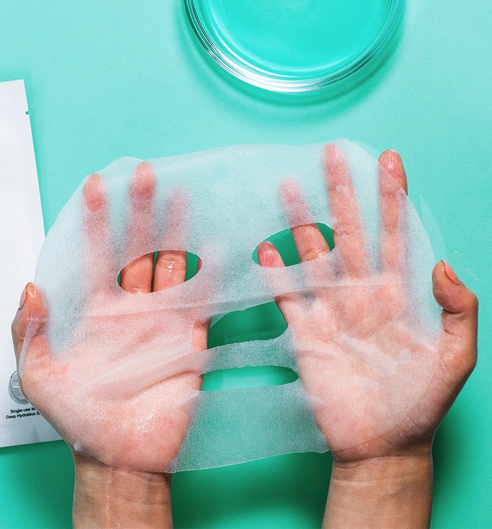 beauty mask stretched over two hands