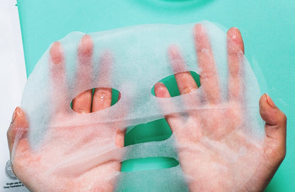 beauty mask stretched over two hands